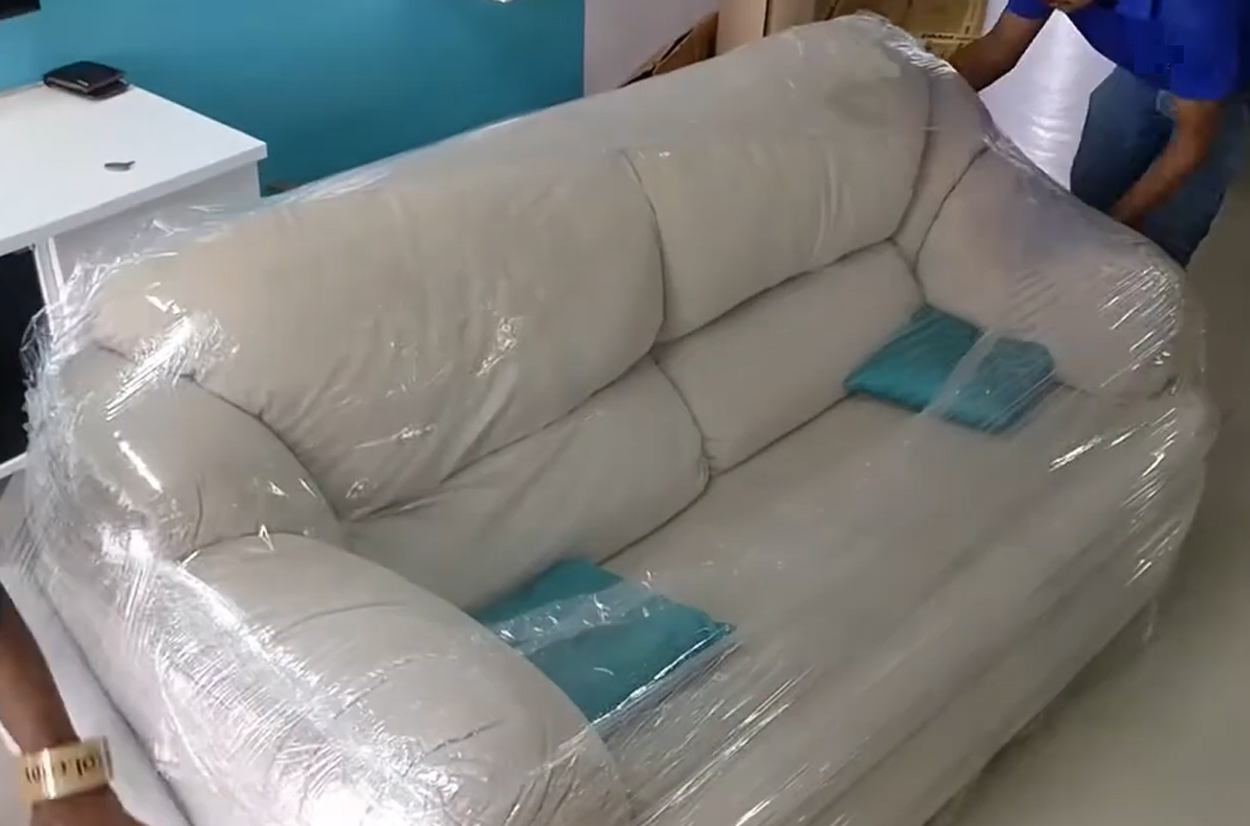 Sofa packaging process at The Sofa Furniture before shipment, illustrating pre-shipment inspection and handling at a sofa factory Vietnam